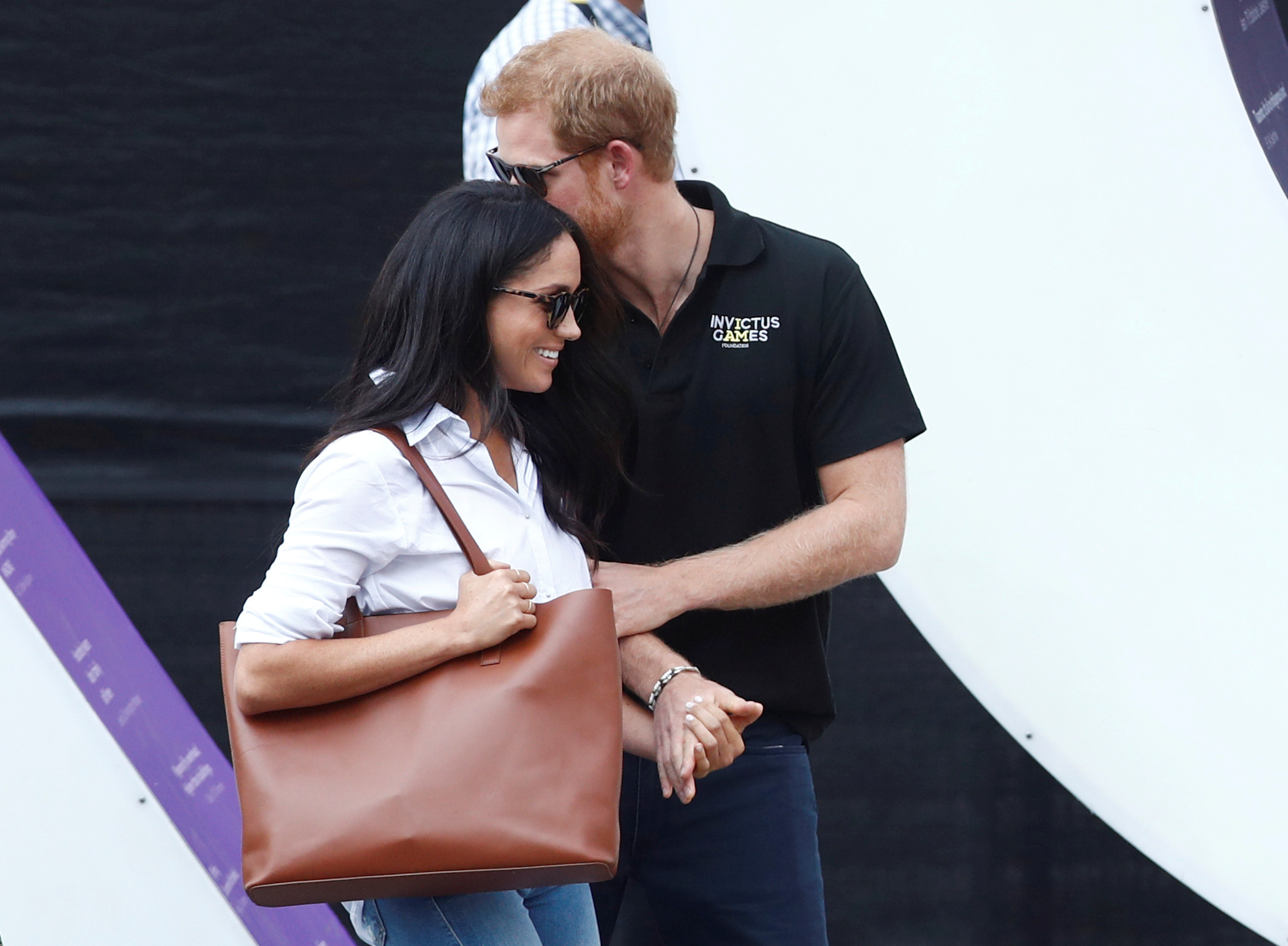 Prince Harry arrives with girlfriend actress Meghan Markle at the wheelchair tennis event during the Invictus Games in Toronto, Canada, September 25, 2017. REUTERS/Mark Blinch