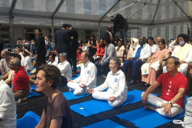 UN Secretary General Ban Ki-moon joins hundreds of yoga.