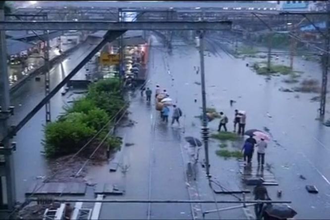 Mumbai limps back to normalcy after heavy rains, train services.